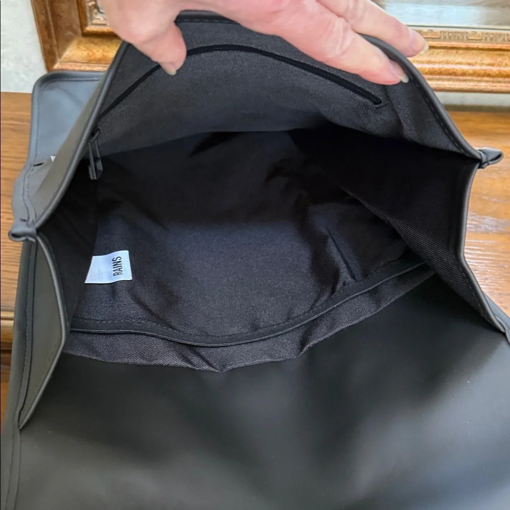 Rains Black Backpack. Clean and ever contemporary.